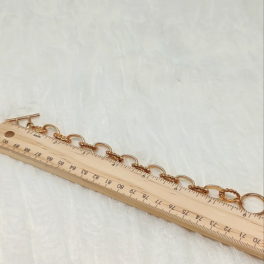 Gold tone oval chain link toggle bracelet